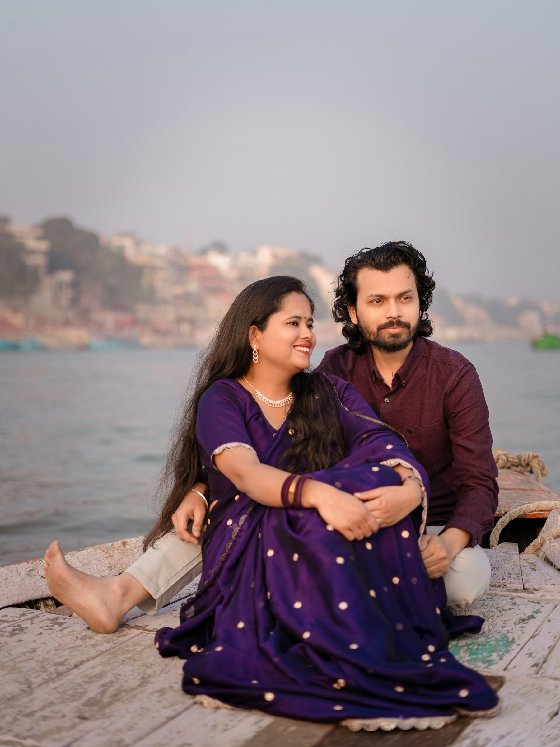 Indian couple enjoying a peaceful boat ride